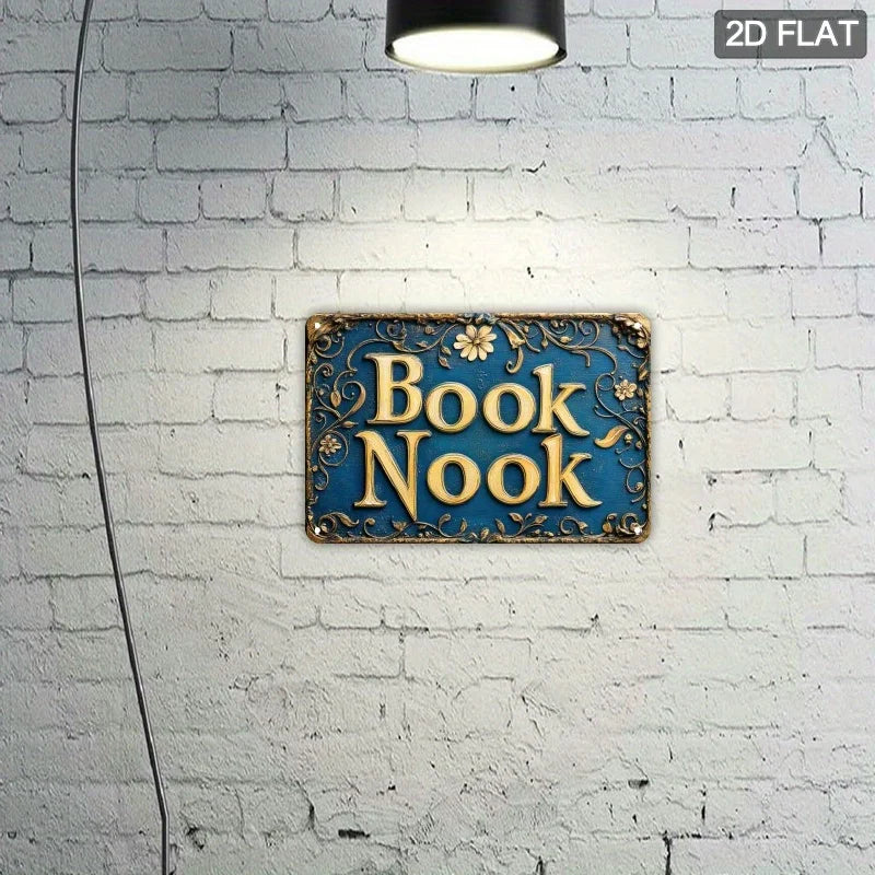 Vintage "Book Nook" Metal Wall Sign , Ornate Golden Lettering on Dark Background with Floral Patterns, Perfect for Room Decor